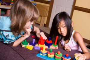 young girls playing with blocks